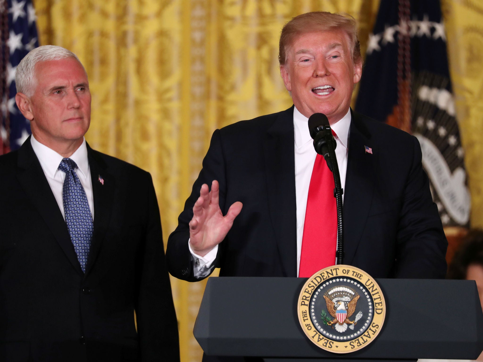 Donald Trump hosts a meeting of the National Space Council as Vice President Mike Pence looks on
