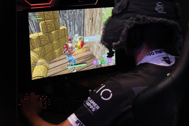 A gamer plays "Fortnite" against Twitch streamer and professional gamer Tyler "Ninja" Blevins during Ninja Vegas '18 at Esports Arena Las Vegas at Luxor Hotel and Casino on April 21, 2018 in Las Vegas, Nevada