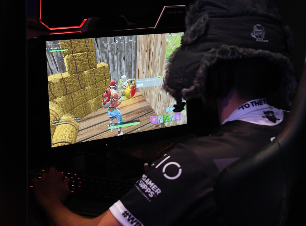 A gamer plays "Fortnite" against Twitch streamer and professional gamer Tyler "Ninja" Blevins during Ninja Vegas '18 at Esports Arena Las Vegas at Luxor Hotel and Casino on April 21, 2018 in Las Vegas, Nevada
