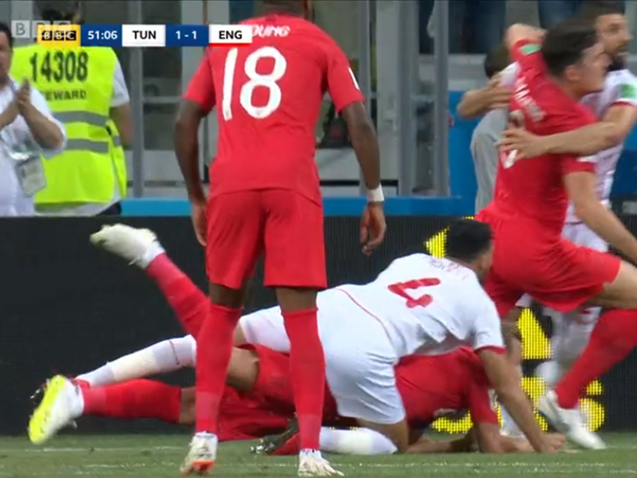 Harry Kane is dragged to the floor