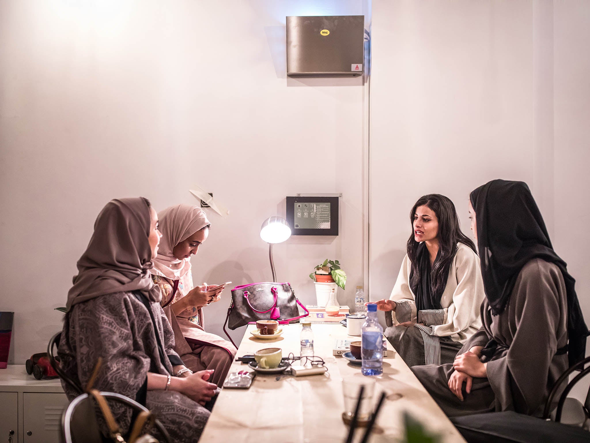 Friends gather inside all-women’s cafe, Nabt Fenjan