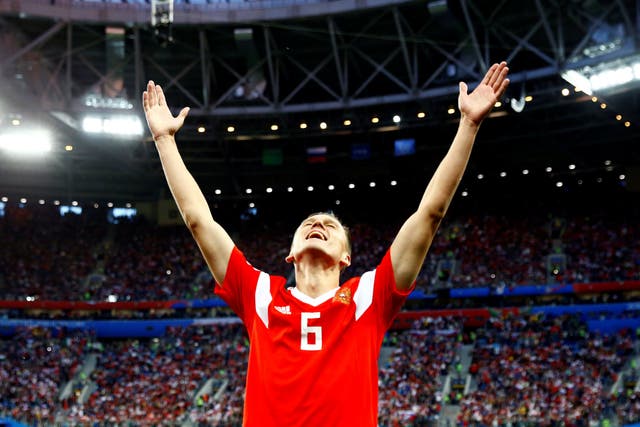 Denis Cheryshev celebrates scoring Russia's second