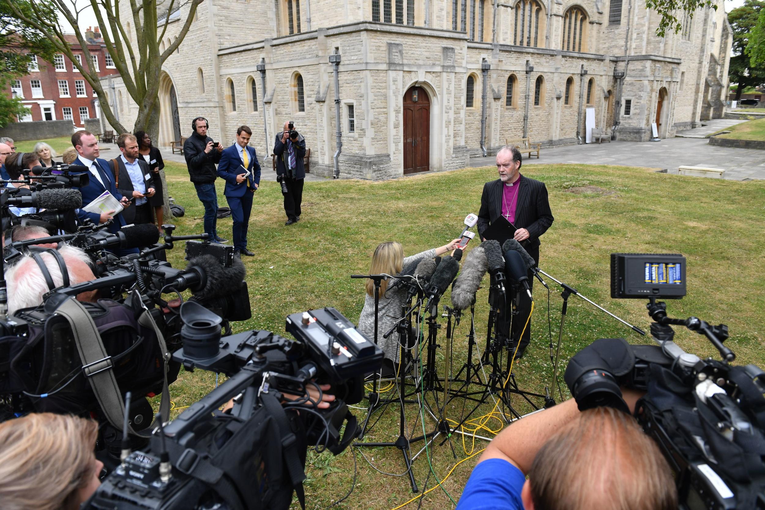 Bishop James Jones delivers a statement on behalf of the panel outside Portsmouth Cathedral