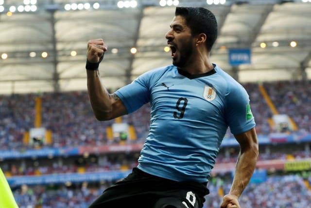 Uruguay's Luis Suarez celebrates scoring his side's first goal