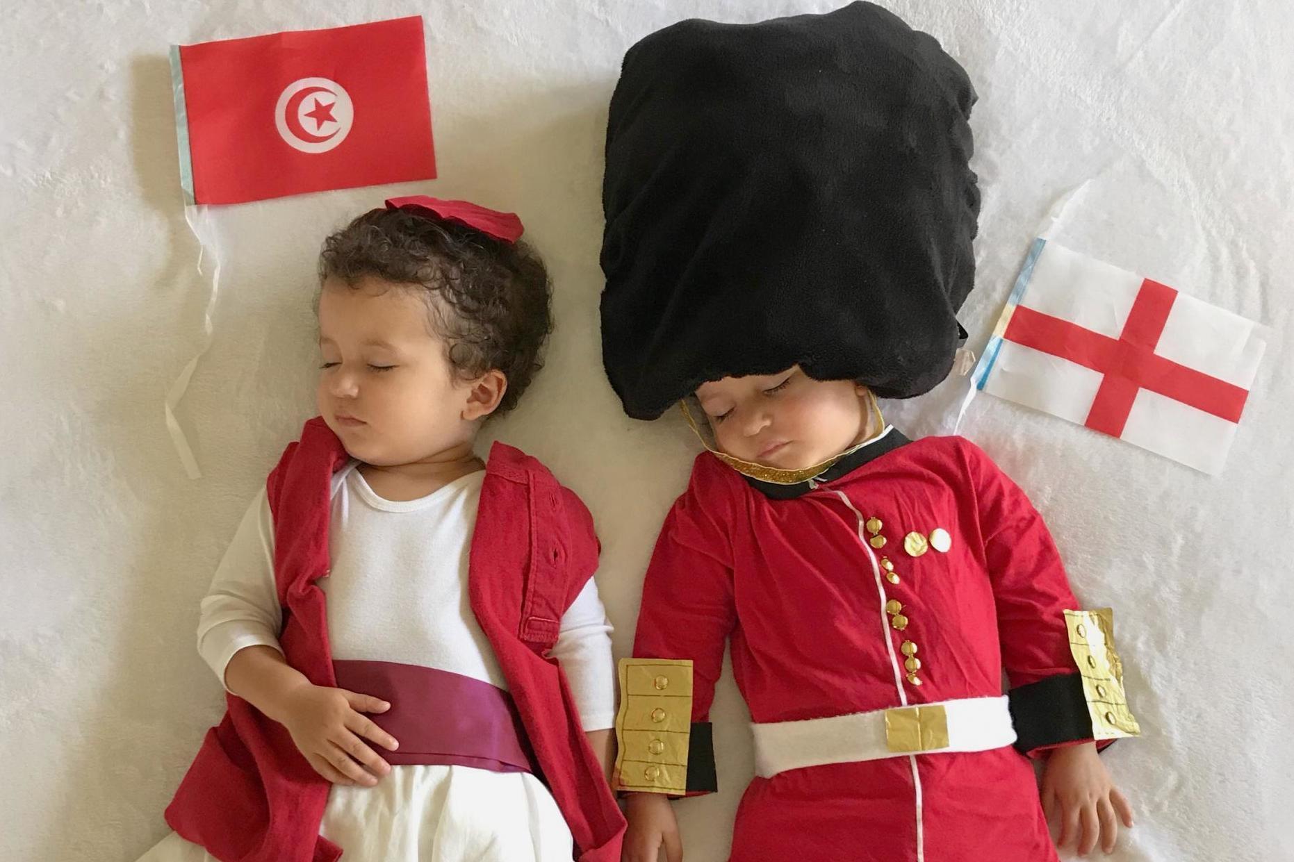 Two-year-old toddlers are dressed as opposing teams in the World Cup (SWNS)