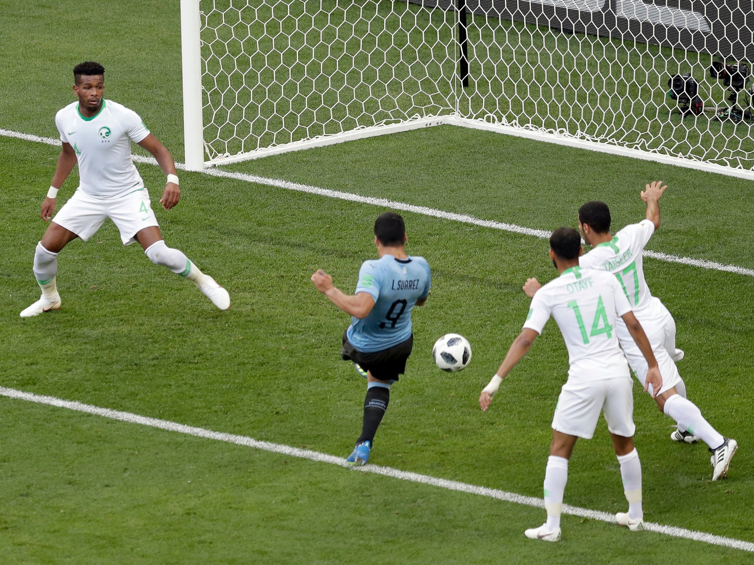 Uruguay's Luis Suarez scores the opening goal