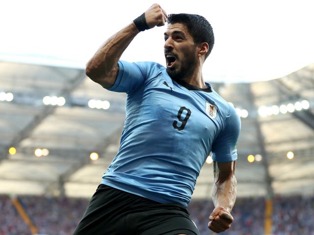 Luis Suarez of Uruguay celebrates after scoring his team's first goal