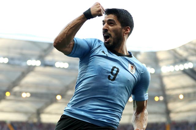 Luis Suarez of Uruguay celebrates after scoring his team's first goal