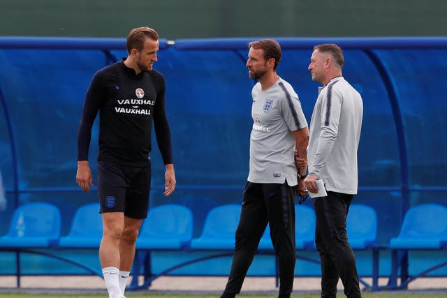 Gareth Southgate and Steve Holland with Harry Kane during an England training session