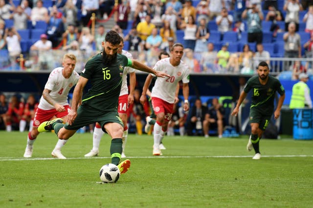 Mile Jedinak of Australia scores his team's first goal from the penalty spot