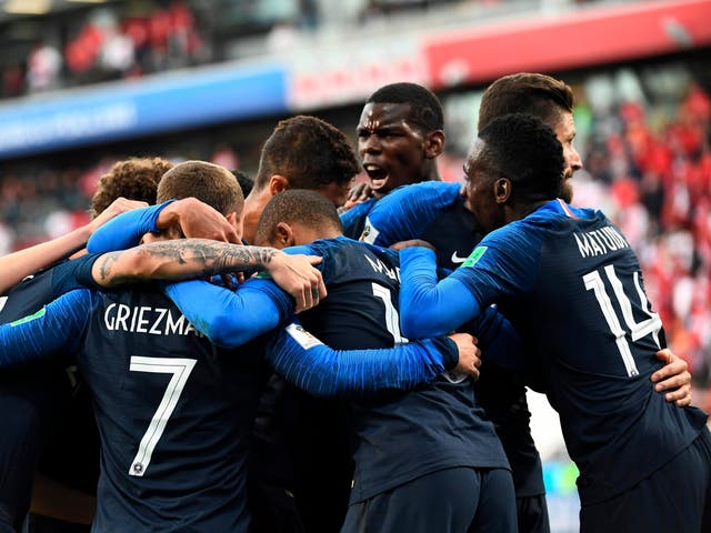 France's forward Kylian Mbappe celebrates scoring the opening goal with his teammates
