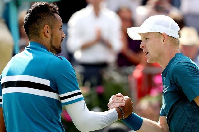 Nick Kyrgios of Australia is congratulated after his men's singles match by Kyle Edmund of Great Britain