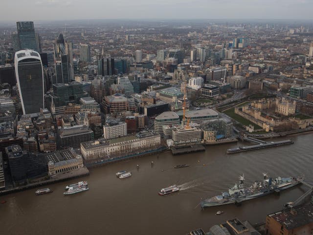 Boats move through the river Thames