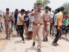 Police suspend three officers over image of 'cow mob' lynching
