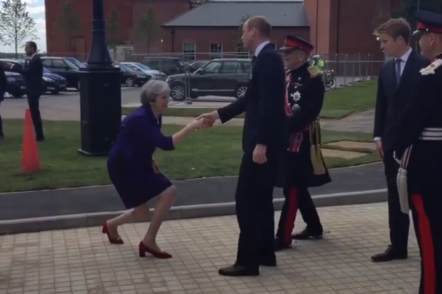 Theresa May greets Prince William with a unique curtsy