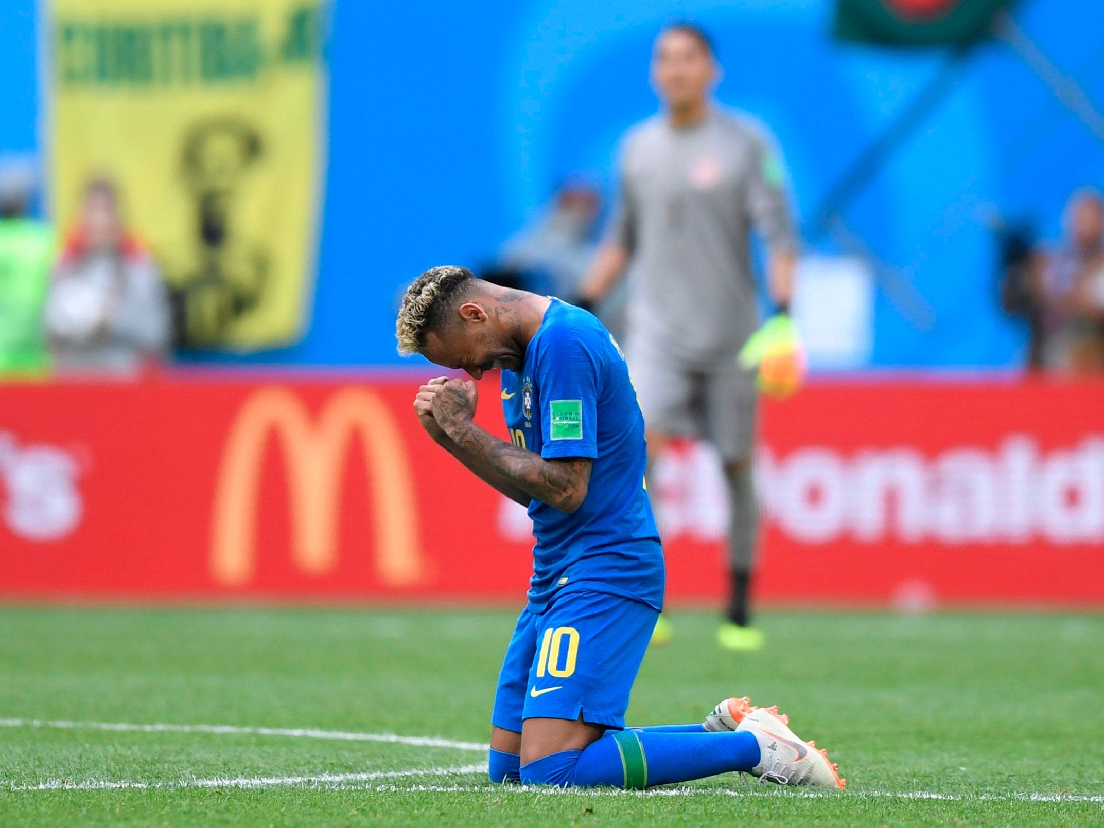 Brazil's forward Neymar cries after scoring a goal