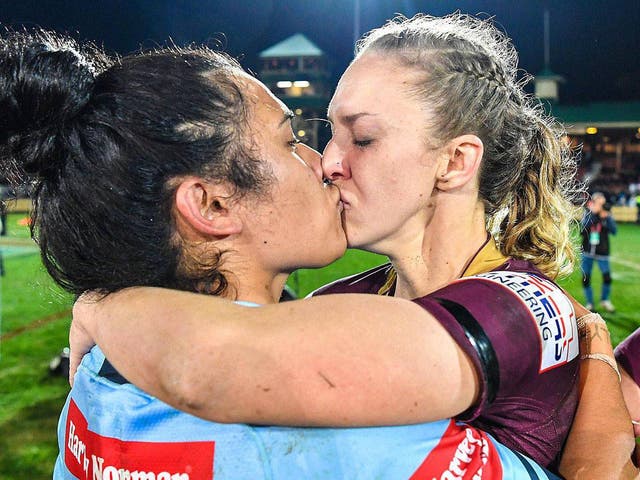 Vanessa Foliaki (left) and Karina Brown embrace following the game