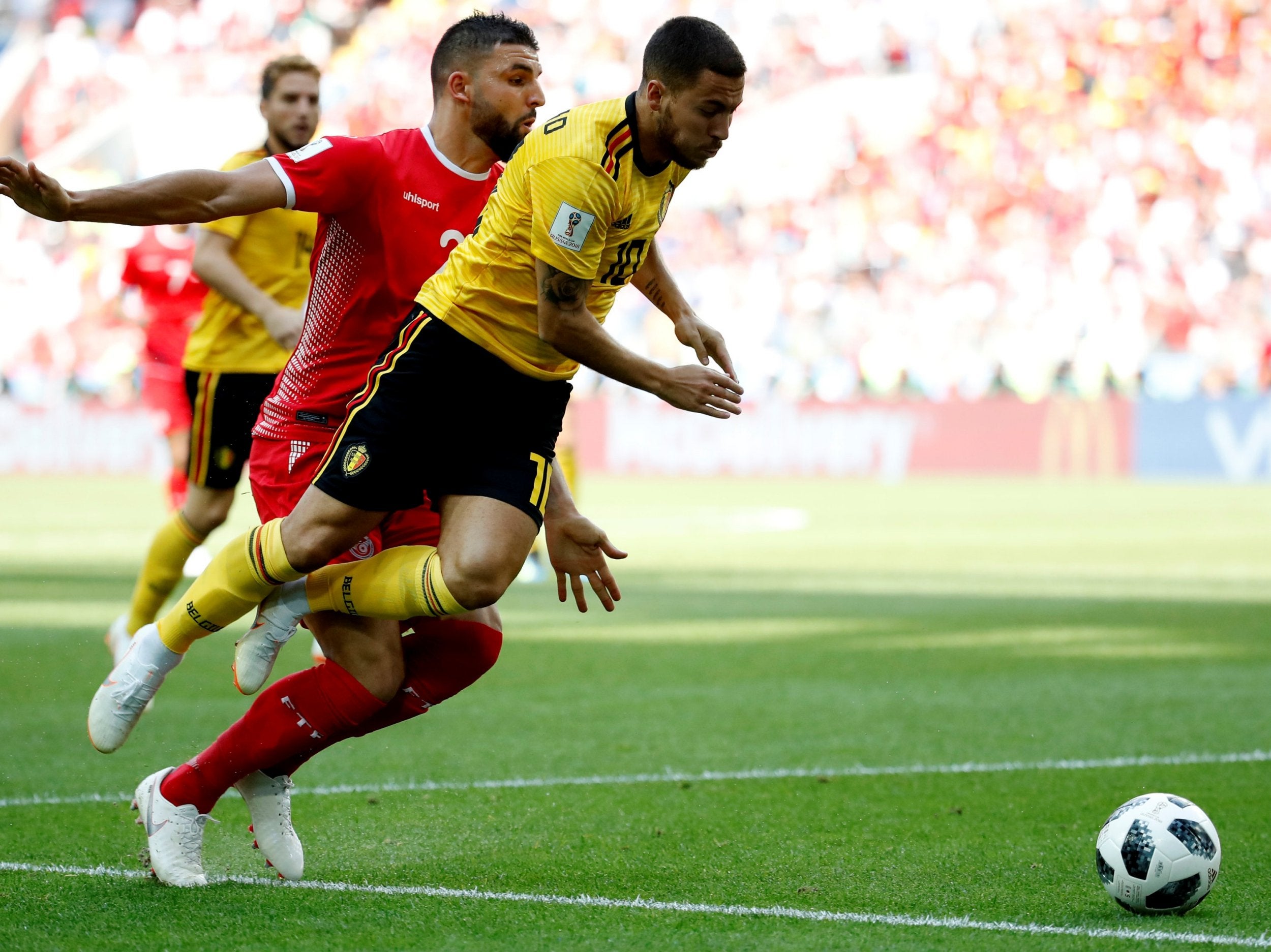 Eden Hazard is brought down inside the penalty area by Syam Ben Youssef