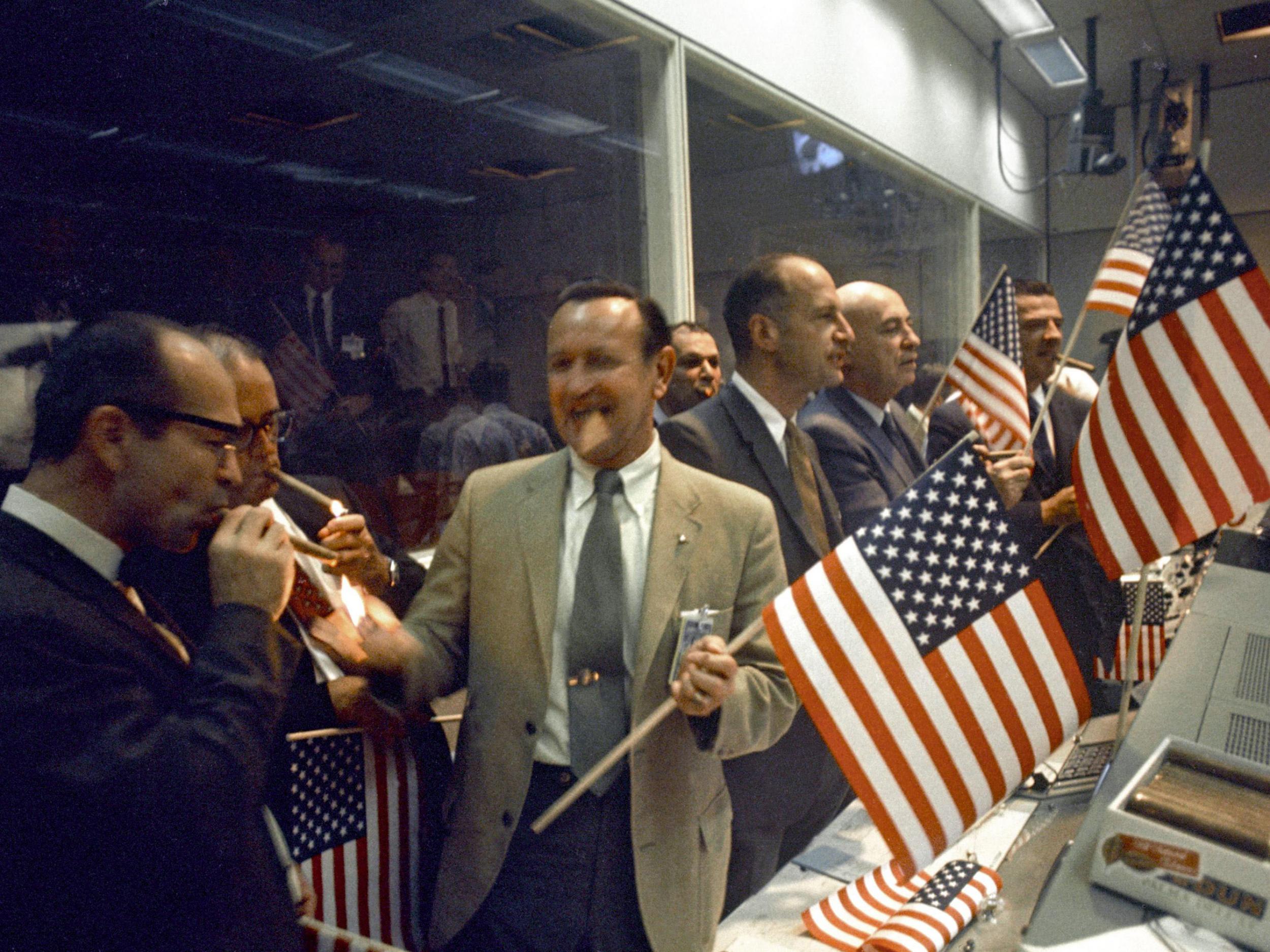 Nasa officials celebrate the successful conclusion of the Apollo 11 lunar landing mission