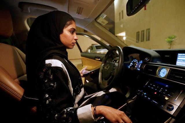 Majdooleen, who is among the first Saudi women allowed to drive in Saudi Arabia gets ready before she starts to drive her car in her neighborhood in Riyadh on 23 June