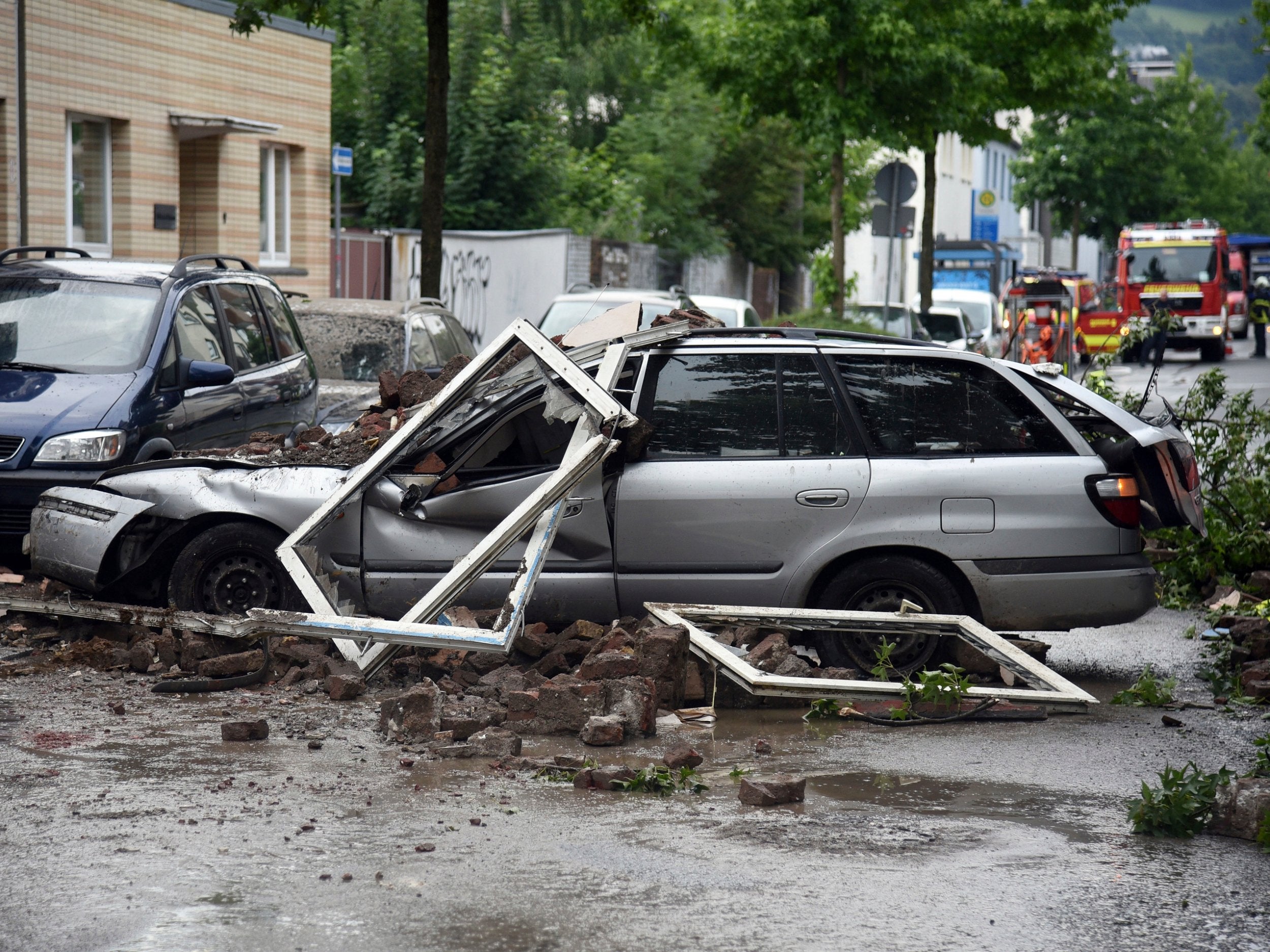 Debris was strewn over the street and a nearby parked car after the explosion