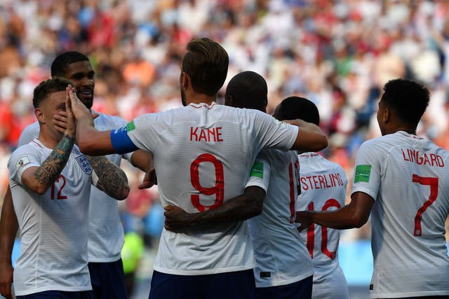 England's forward Harry Kane celebrates a goal with teammates