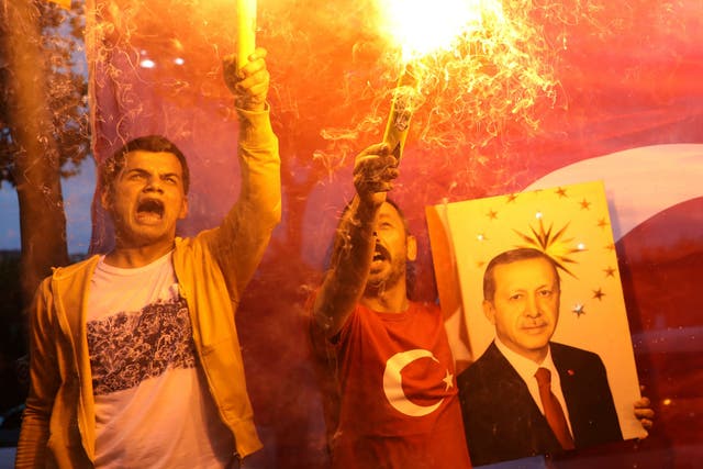 Supporters of Turkey's Recep Tayyip Erdogan celebrate  in front of AKP headquarters in Istanbul