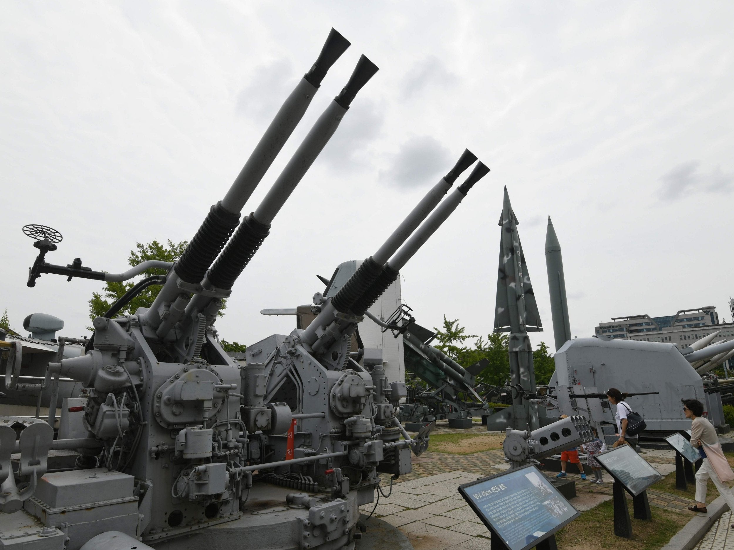 Visitors walk past weapons displayed at the Korean War Memorial in Seoul