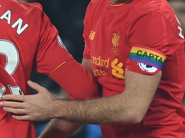 Liverpool midfielder Jordan Henderson wears a rainbow captain's armband in support of LGBT players and fans