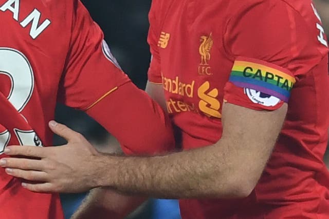 <p>Liverpool midfielder Jordan Henderson wears a rainbow captain's armband in support of LGBT players and fans</p>