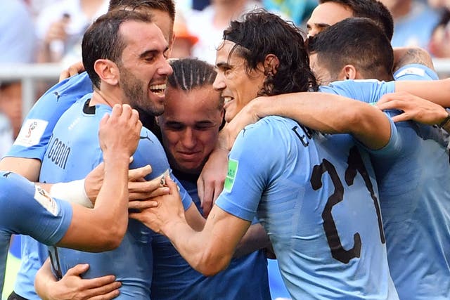 Uruguay's defender Diego Laxalt celebrates with teammates