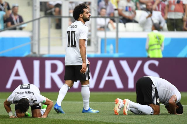 Egypt's players react as forward Mohamed Salah