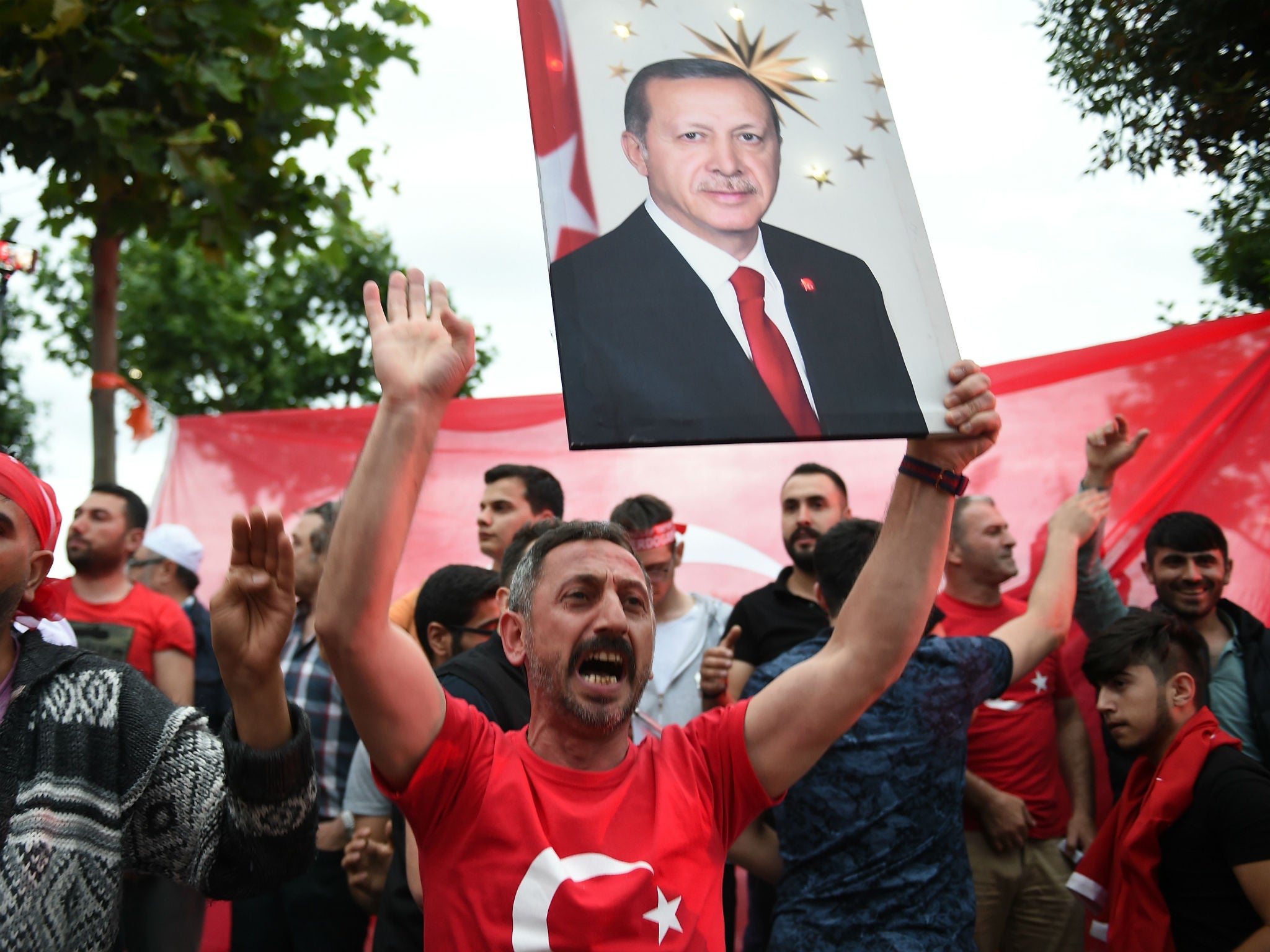 President Erdogan’s supporters celebrate outside AKP headquarters