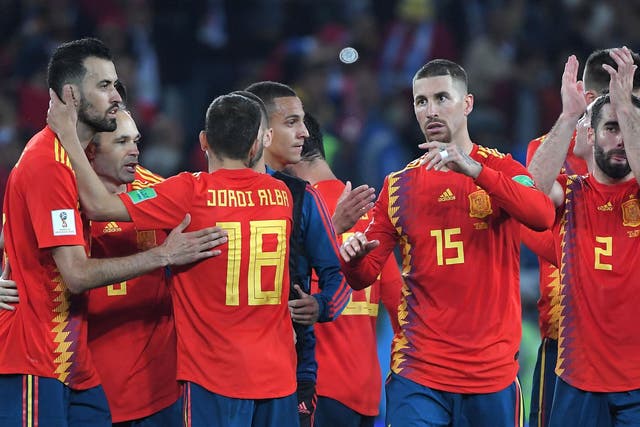 Spain top Group B and will play Russia in the round of 16