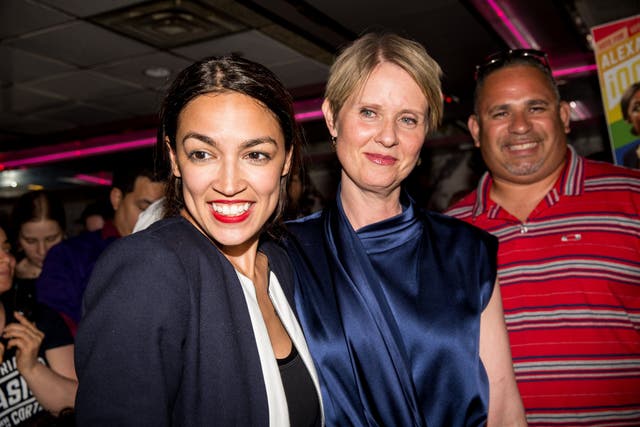 Alexandria Ocasio-Cortez at her victory party in the Bronx alongside Cynthia Nixon