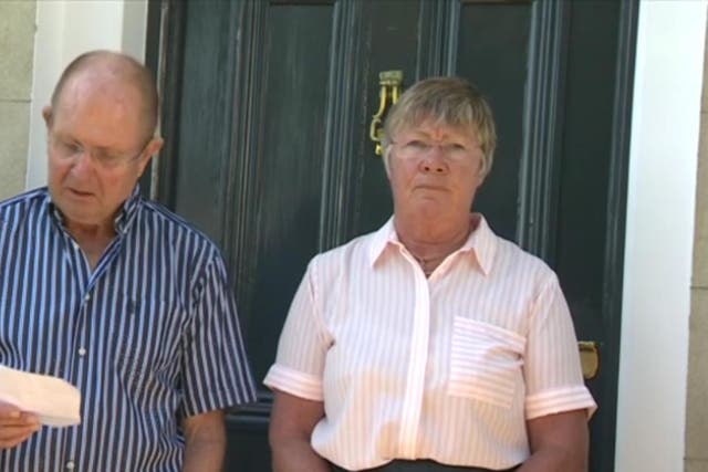 Dr Jane Barton outside her Gosport home while husband Tim Barton reads statement