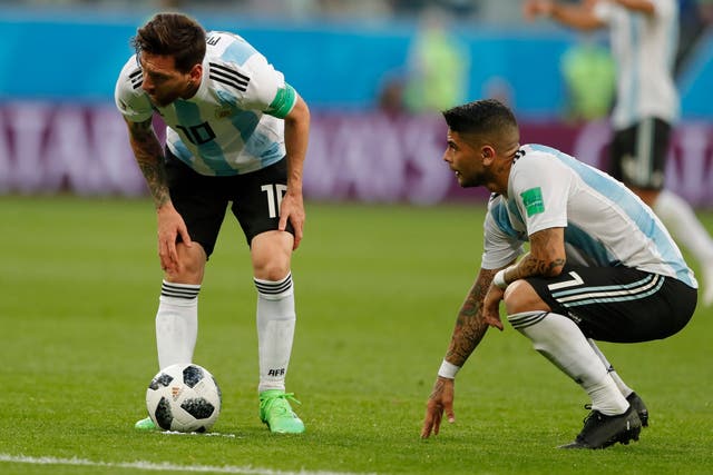 Argentina's Lionel Messi, left, is flanked by his teammate Argentina's Ever Banega during the group D match between Argentina and Nigeria