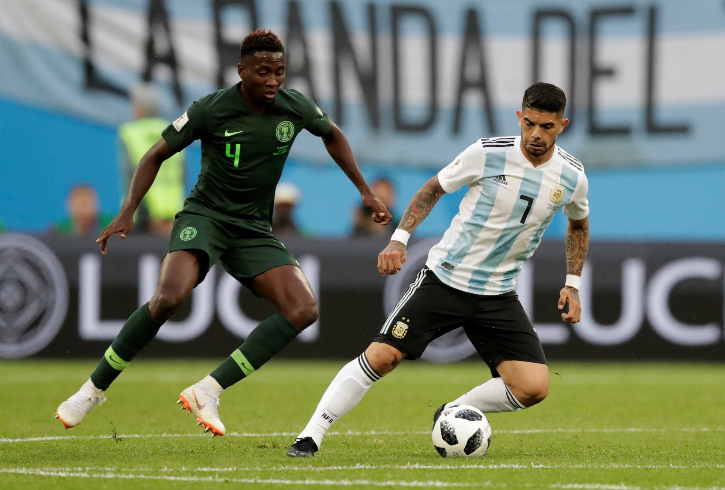 Argentina's Ever Banega in action with Nigeria's Wilfred Ndidi