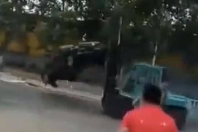 Footage showed Wang Zhihua lifting vehicles in the street in his forklift truck