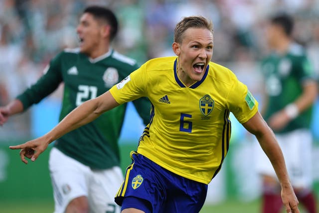 Sweden's defender Ludwig Augustinsson celebrates after scoring the opening goal