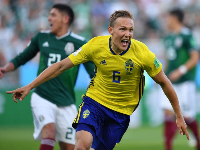 Sweden's defender Ludwig Augustinsson celebrates after scoring the opening goal