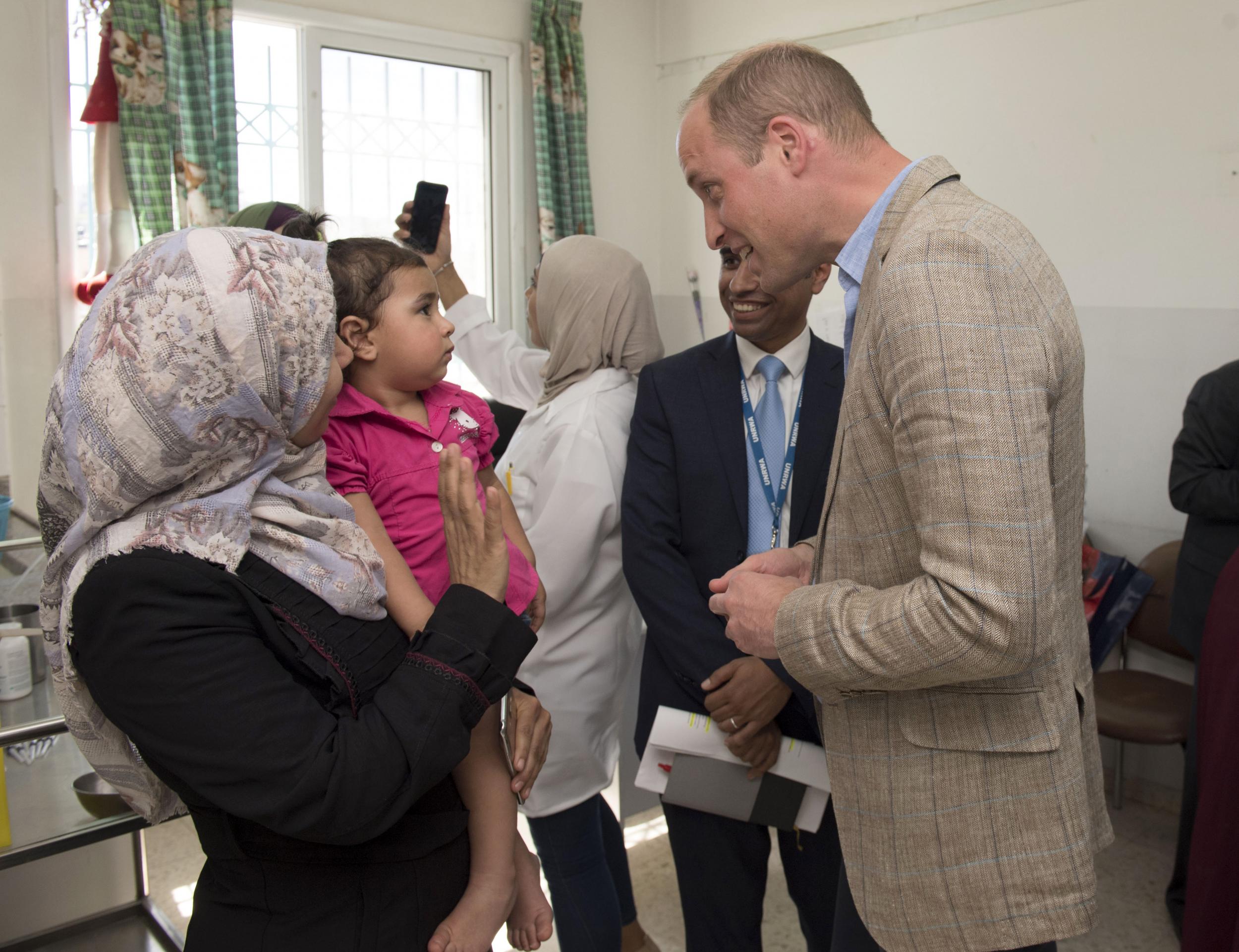 Prince William meets members of the community at Jalazone refugee camp, north of Ramallah, on 27 June 2018