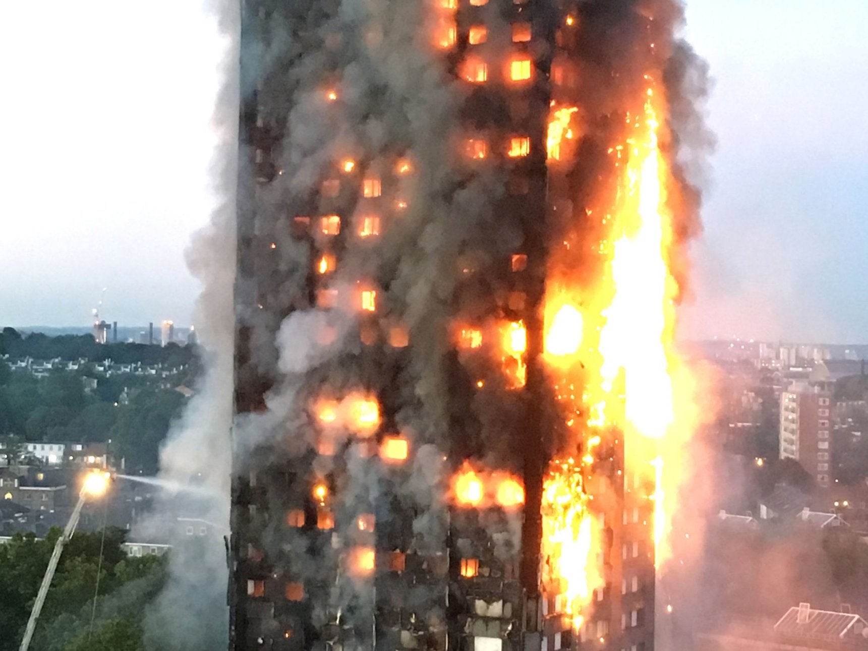The firefighter tried to get residents to leave the flaming tower by banging on doors