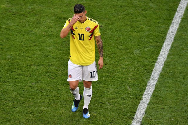 James Rodriguez of Colombia looks dejected as he is substituted off due to injury