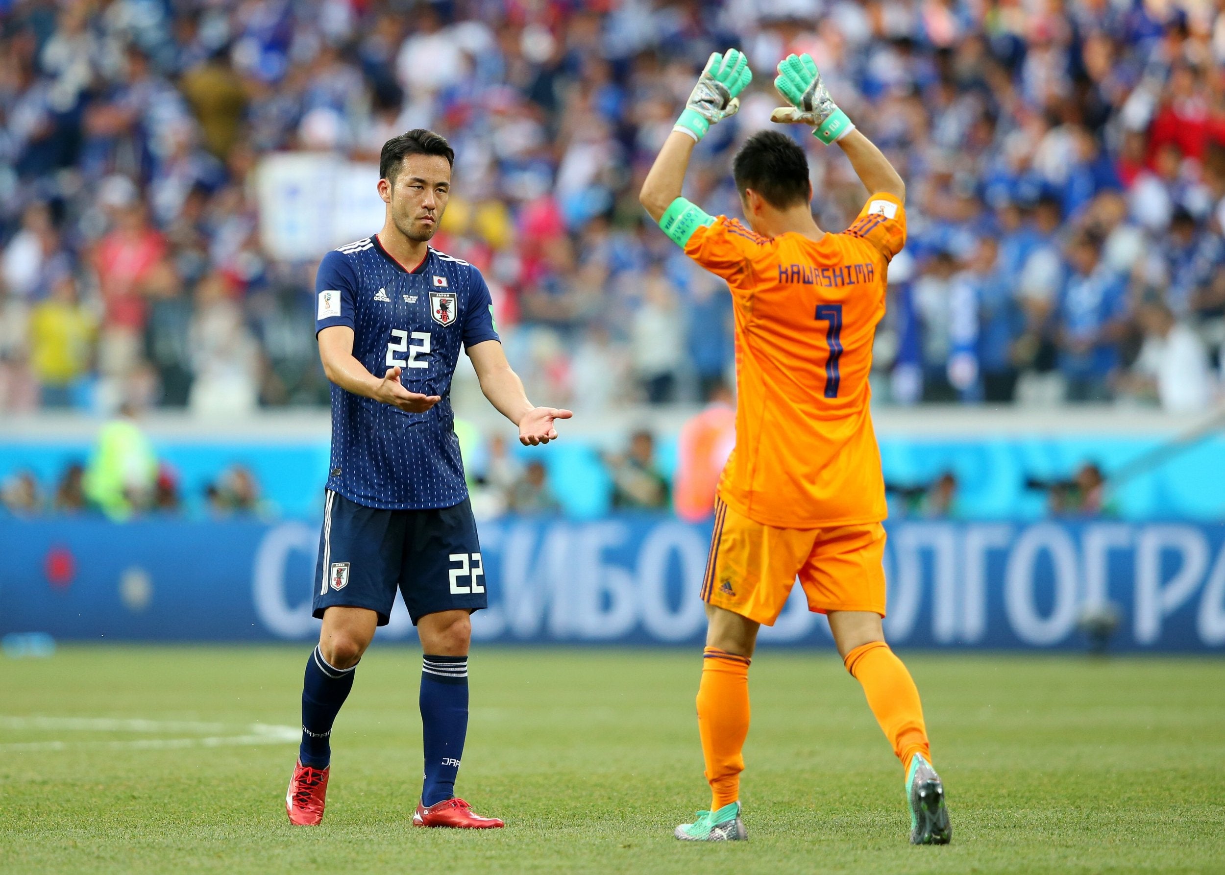 Maya Yoshida of Japan and Eiji Kawashima of Japan celebrate