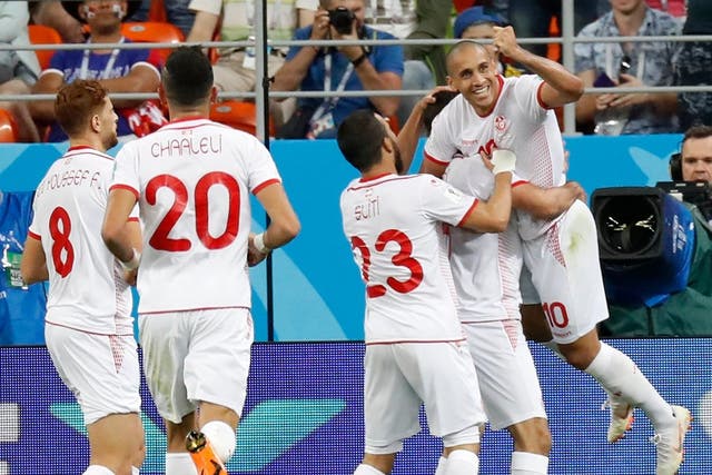 Tunisia's Wahbi Khazri, right, celebrates with teammates after scoring his side's second goal