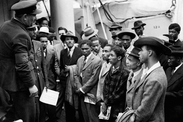 Jamaican immigrants welcomed by RAF officials after the ex-troopship HMT 'Empire Windrush' landed them at Tilbury in 1948