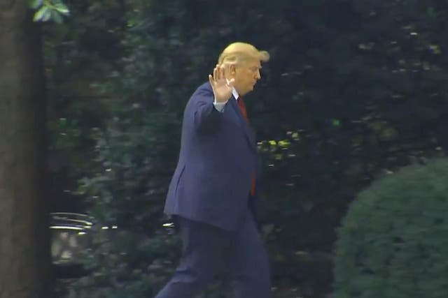 Donald Trump waves away requests to speak to the media outside the White House about the murder of five journalists at Annapolis newspaper the Capital Gazette