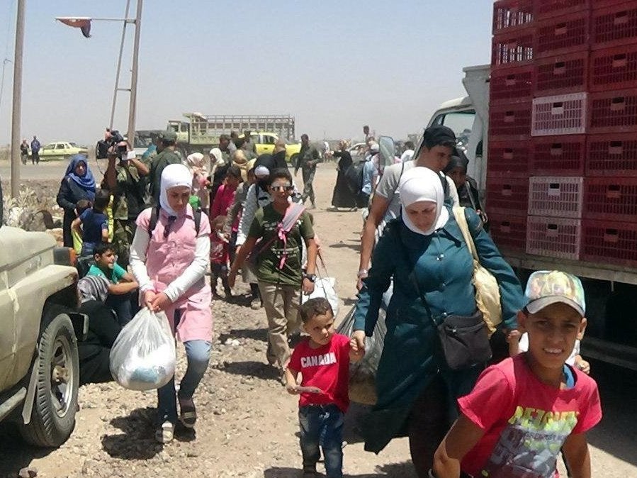 People flee the violence with their belongings in the Deraa countryside