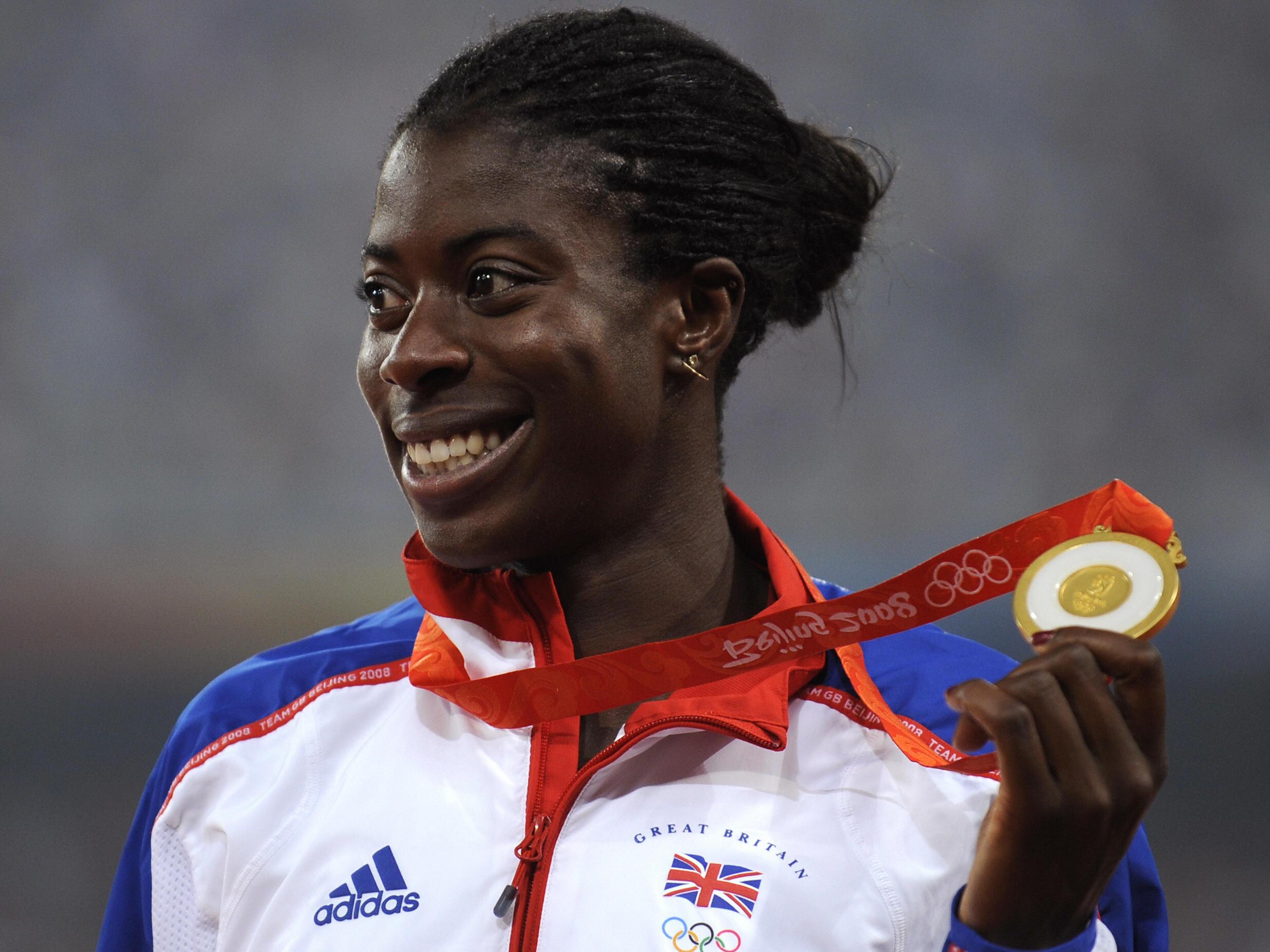 Britain's gold medalist Christine Ohuruogu poses on the podium